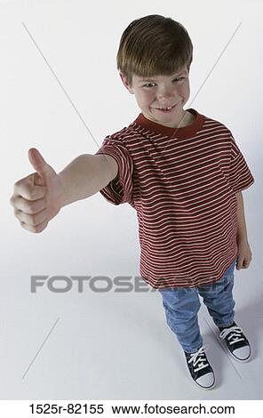Portrait of a boy making a thumb's up sign View Large Photo Image Stock Photography - Portrait of a boy making a thumb's up sign. Fotosearch