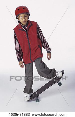 Portrait of a boy on a skateboard View Large Photo Image Stock Image - Portrait of a boy on a skateboard. Fotosearch