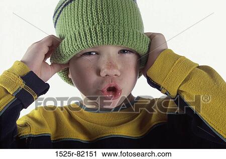 Portrait of a boy wearing a hat View Large Photo Image Stock Image - Portrait of a boy wearing a hat. Fotosearch