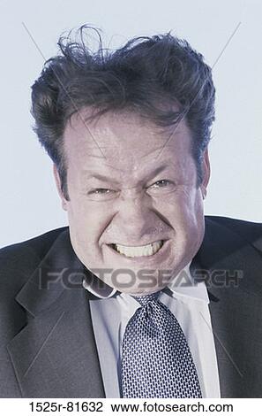 Portrait of a businessman clenching his teeth in anger View Large Photo Image Stock Image - Portrait of a businessman clenching his teeth in anger. Fotosearch
