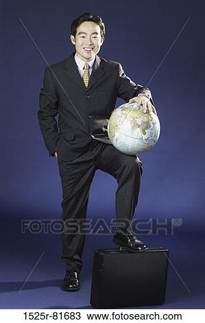 Portrait of a businessman holding a globe View Large Photo Image Stock Image - Portrait of a businessman holding a globe. Fotosearch