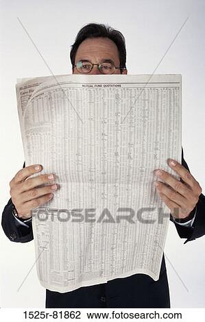 Portrait of a businessman holding a newspaper View Large Photo Image Stock Image - Portrait of a businessman holding a newspaper. Fotosearch