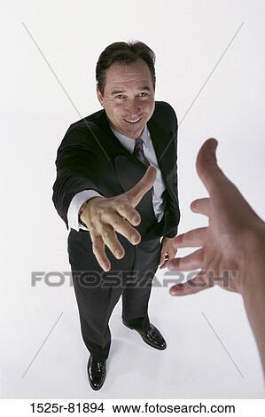 Portrait of a businessman holding his hand out View Large Photo Image Picture - Portrait of a businessman holding his hand out. Fotosearch