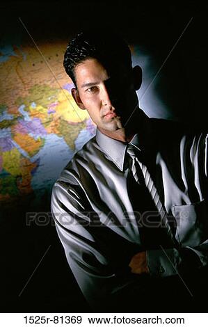 Portrait of a businessman in front of a map View Large Photo Image Stock Photo - Portrait of a businessman in front of a map. Fotosearch