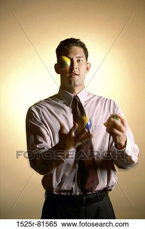 Portrait of a businessman juggling balls View Large Photo Image Stock Photography - Portrait of a businessman juggling balls. Fotosearch