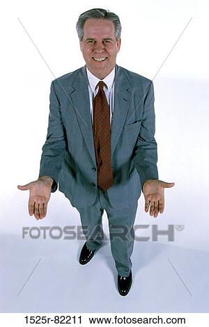 Portrait of a businessman smiling View Large Photo Image Stock Image - Portrait of a businessman smiling. Fotosearch