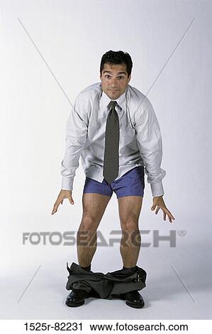 Portrait of a businessman standing with his pants down View Large Photo Image Stock Image - Portrait of a businessman standing with his pants down. Fotosearch