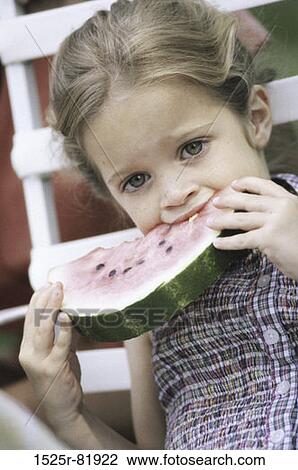 Portrait of a girl eating a slice of watermelon View Large Photo Image Stock Image - Portrait of a girl eating a slice of watermelon. Fotosearch