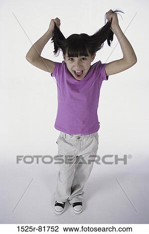 Portrait of a girl pulling her hair View Large Photo Image Stock Image - Portrait of a girl pulling her hair. Fotosearch