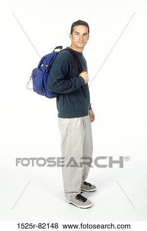 Stock Photo - Portrait of a male student carrying a backpack. Fotosearch