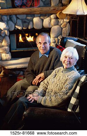 Stock Photo - Portrait of a senior couple sitting side by side. Fotosearch