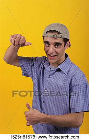 Portrait of a teenage boy gesturing with his hands View Large Photo Image Stock Photo - Portrait of a teenage boy gesturing with his hands. Fotosearch
