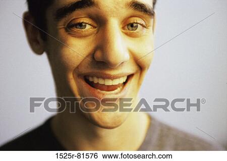 Portrait of a teenage boy laughing View Large Photo Image Stock Photograph - Portrait of a teenage boy laughing. Fotosearch
