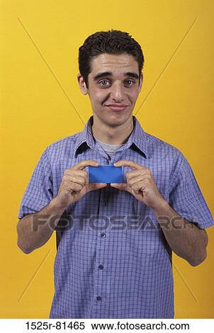 Stock Photography - Portrait of a teenage boy making a face. Fotosearch