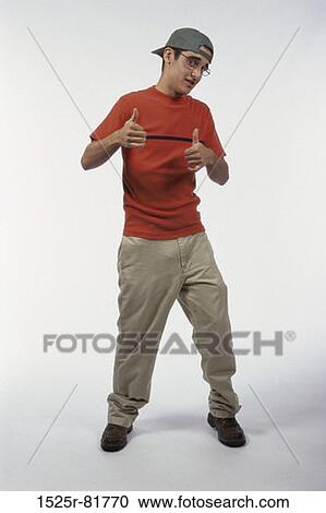 Portrait of a teenage boy showing thumbs up View Large Photo Image Stock Image - Portrait of a teenage boy showing thumbs up. Fotosearch