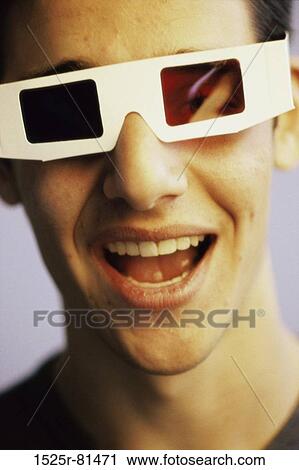 Portrait of a teenage boy wearing 3-D glasses View Large Photo Image Stock Image - Portrait of a teenage boy wearing 3-D glasses. Fotosearch
