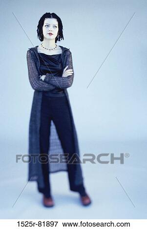 Portrait of a teenage girl standing with her arms folded View Large Photo Image Stock Photo - Portrait of a teenage girl standing with her arms folded. Fotosearch