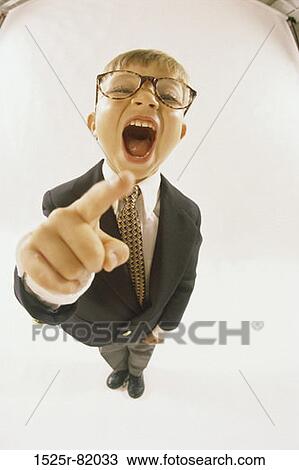 Portrait of a young boy dressed as a businessman laughing View Large Photo Image Stock Image - Portrait of a young boy dressed as a businessman laughing. Fotosearch