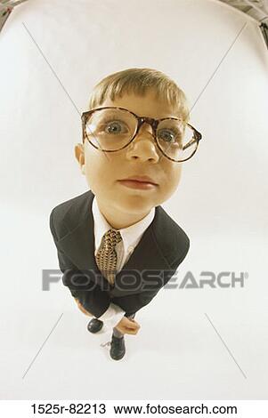 Portrait of a young boy dressed as a businessman View Large Photo Image Stock Image - Portrait of a young boy dressed as a businessman. Fotosearch