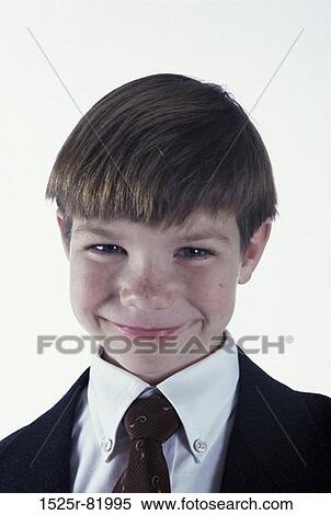 Portrait of a young boy dressed as a businessman View Large Photo Image Stock Photography - Portrait of a young boy dressed as a businessman. Fotosearch