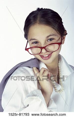 Portrait of a young girl dressed as a businesswoman smiling View Large Photo Image Stock Image - Portrait of a young girl dressed as a businesswoman smiling. Fotosearch