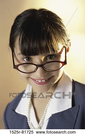 Portrait of a young girl dressed as a businesswoman smiling View Large Photo Image Stock Photography - Portrait of a young girl dressed as a businesswoman smiling. Fotosearch