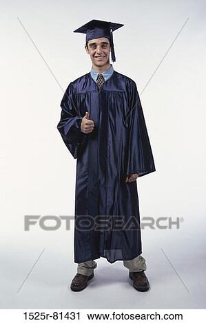 Portrait of a young male graduate showing thumbs up View Large Photo Image Stock Image - Portrait of a young male graduate showing thumbs up. Fotosearch