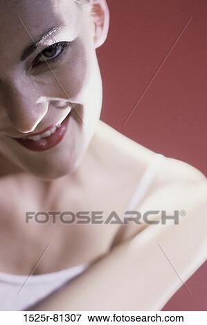 Portrait of a young woman smiling View Large Photo Image Stock Photo - Portrait of a young woman smiling. Fotosearch