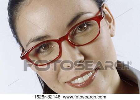 Stock Photograph - Portrait of a young woman smiling. Fotosearch