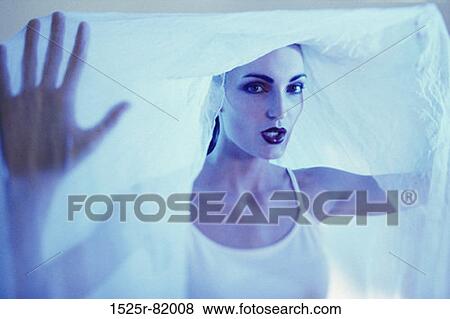 Portrait of a young woman with a cloth over her head View Large Photo Image Stock Photo - Portrait of a young woman with a cloth over her head. Fotosearch