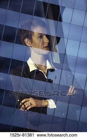Reflection of a businesswoman in an office window View Large Photo Image Stock Image - Reflection of a businesswoman in an office window. Fotosearch
