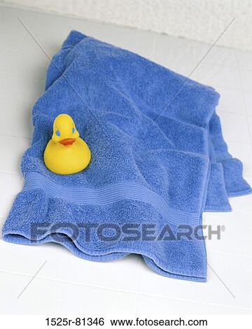 Rubber duck on a towel View Large Photo Image Stock Photograph - Rubber duck on a towel. Fotosearch