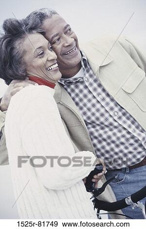 Senior couple holding each other smiling View Large Photo Image Stock Photo - Senior couple holding each other smiling. Fotosearch