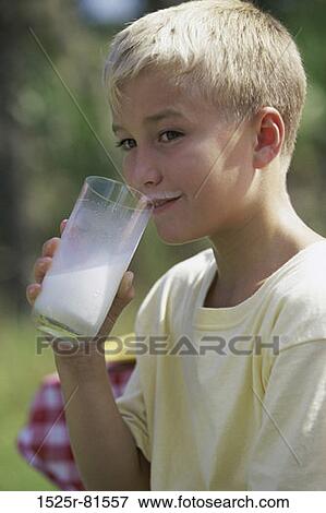 Side profile of a boy drinking milk from a glass View Large Photo Image Stock Photo - Side profile of a boy drinking milk from a glass. Fotosearch