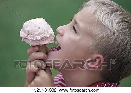 Side profile of a boy eating an ice cream cone View Large Photo Image Stock Image - Side profile of a boy eating an ice cream cone. Fotosearch