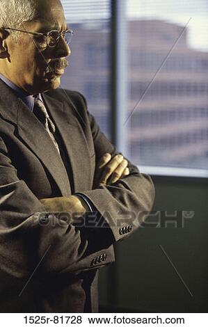 Stock Photo - Side profile of a businessman thinking. Fotosearch