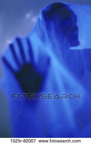 Silhouette of a woman behind a cloth View Large Photo Image Stock Photo - Silhouette of a woman behind a cloth. Fotosearch