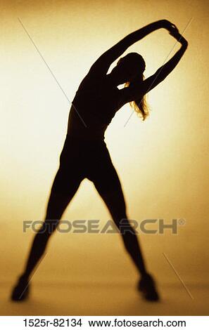 Silhouette of a woman exercising View Large Photo Image Picture - Silhouette of a woman exercising. Fotosearch
