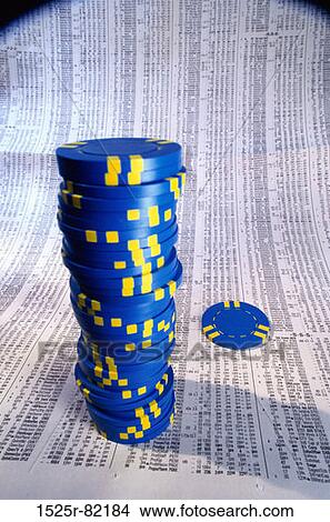 Stack of gambling chips on stock quotes View Large Photo Image Picture - Stack of gambling chips on stock quotes. Fotosearch