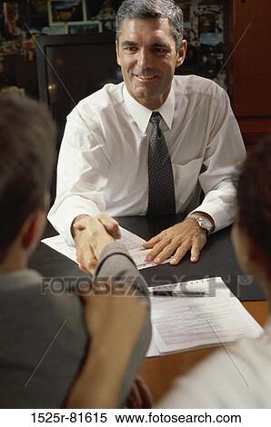 Stock Photography - Three business executives in a meeting. Fotosearch