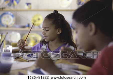 Two children painting with paintbrushes View Large Photo Image Stock Image - Two children painting with paintbrushes. Fotosearch