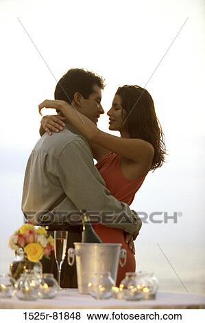 Young couple hugging on the beach View Large Photo Image Stock Photo - Young couple hugging on the beach. Fotosearch