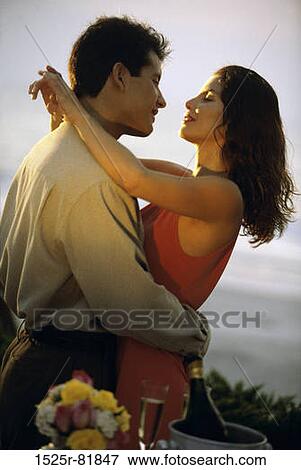 Young couple romancing on the beach View Large Photo Image Stock Photo - Young couple romancing on the beach. Fotosearch