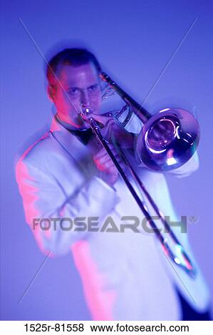 Young man playing the trombone View Large Photo Image Stock Photo - Young man playing the trombone. Fotosearch