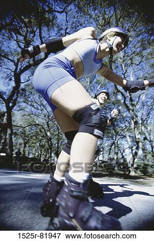 Young woman inline skating on road View Large Photo Image Stock Photo - Young woman inline skating on road. Fotosearch