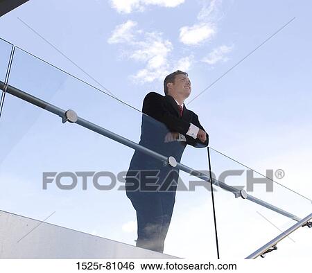 business man in black suit and red tie stands with vision pose View Large Photo Image Stock Photograph - business man in black suit and red tie stands with vision pose. Fotosearch