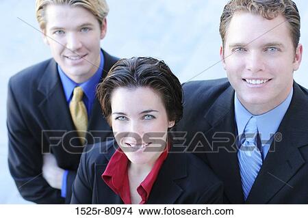 Business Team Looks Up and smiles as they stand together in unity View Large Photo Image Picture - Business Team Looks Up and smiles as they stand together in unity. Fotosearch