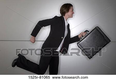 Side profile of a businesswoman running View Large Photo Image Stock Photography - Side profile of a businesswoman running. Fotosearch