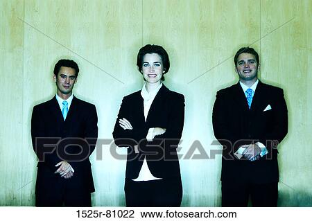 Three Business People standing with the business woman in the middle in between two business men View Large Photo Image Stock Image - Three Business People standing with the business woman in the middle in between two business men. Fotosearch