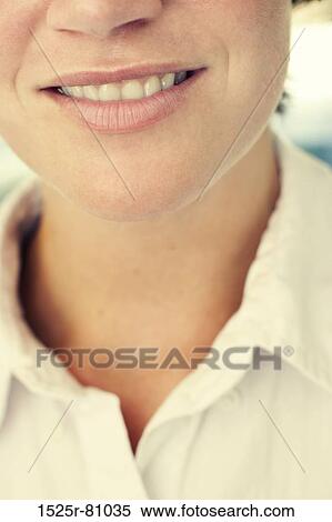 Younger woman wearing white shirt smiles View Large Photo Image Stock Photography - Younger woman wearing white shirt smiles. Fotosearch